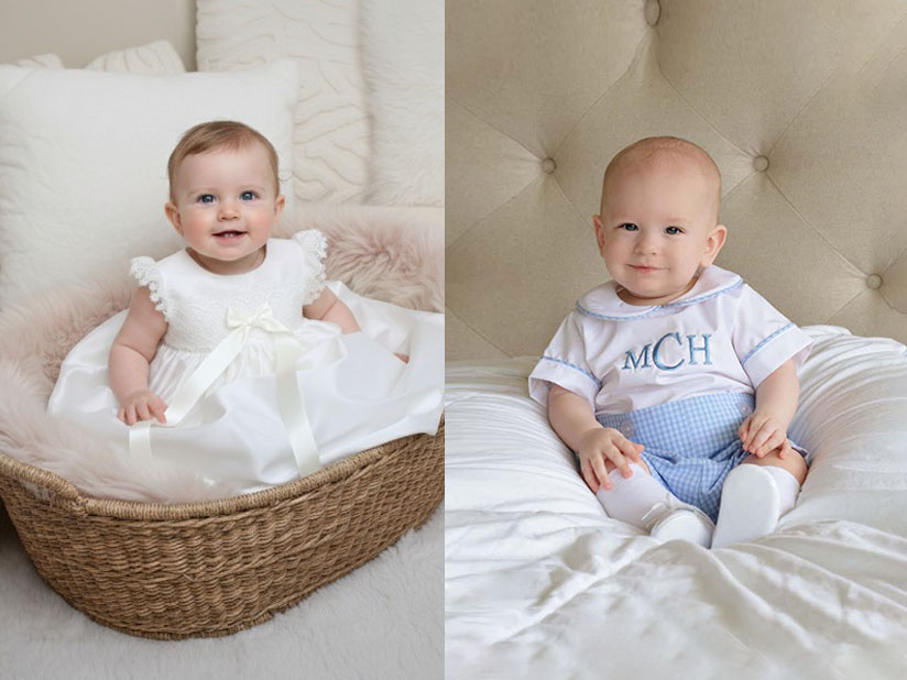 Baby girl in a white baptism dress and baby boy in a light blue outfit, showing different color options for baptism clothing