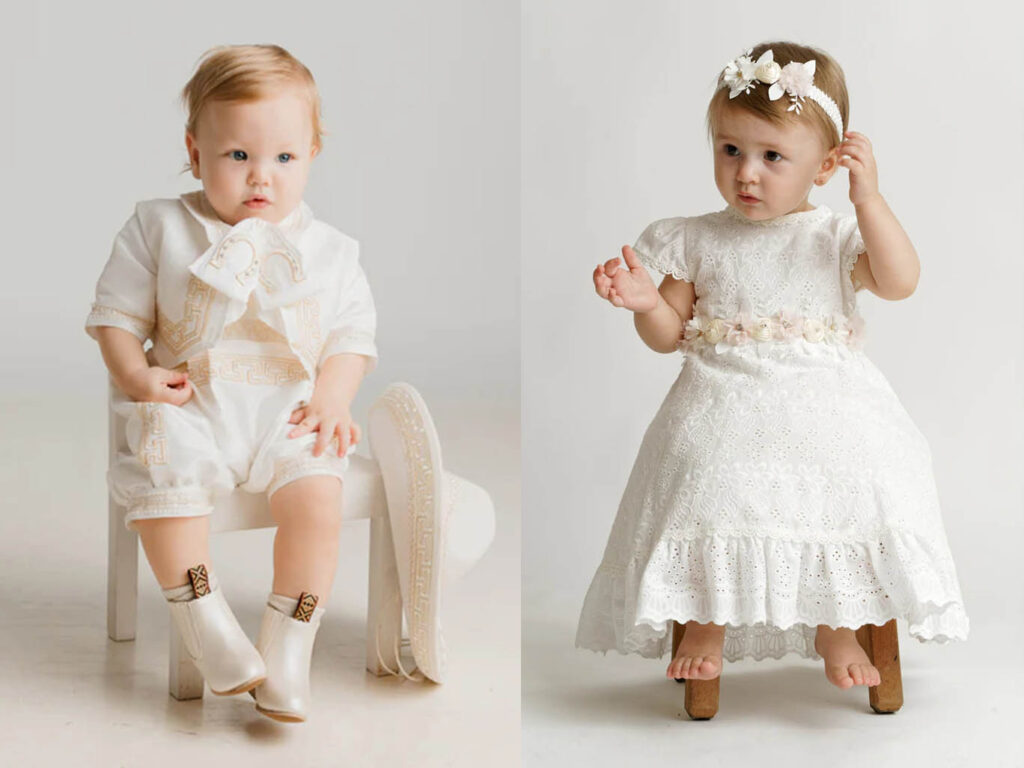 Toddler boy in a white embroidered romper and toddler girl in a white lace dress, showing baptism outfit options for older children