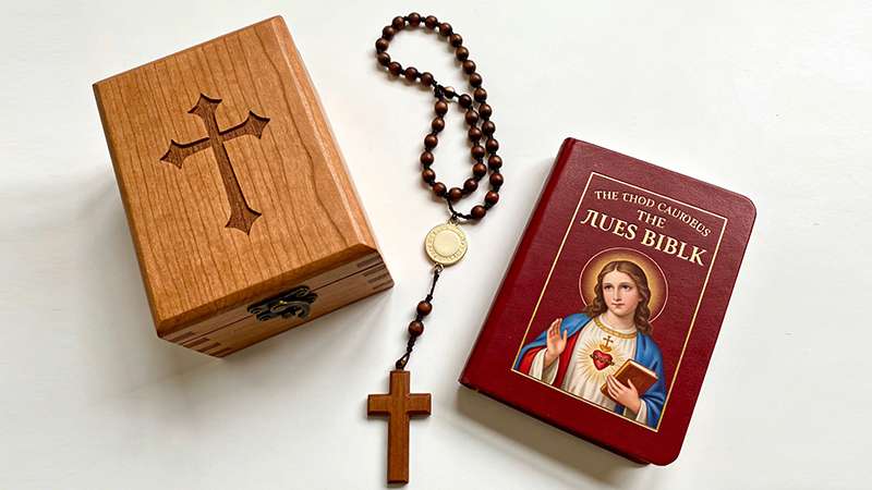 First Communion gifts for boys: cross necklace and Bible